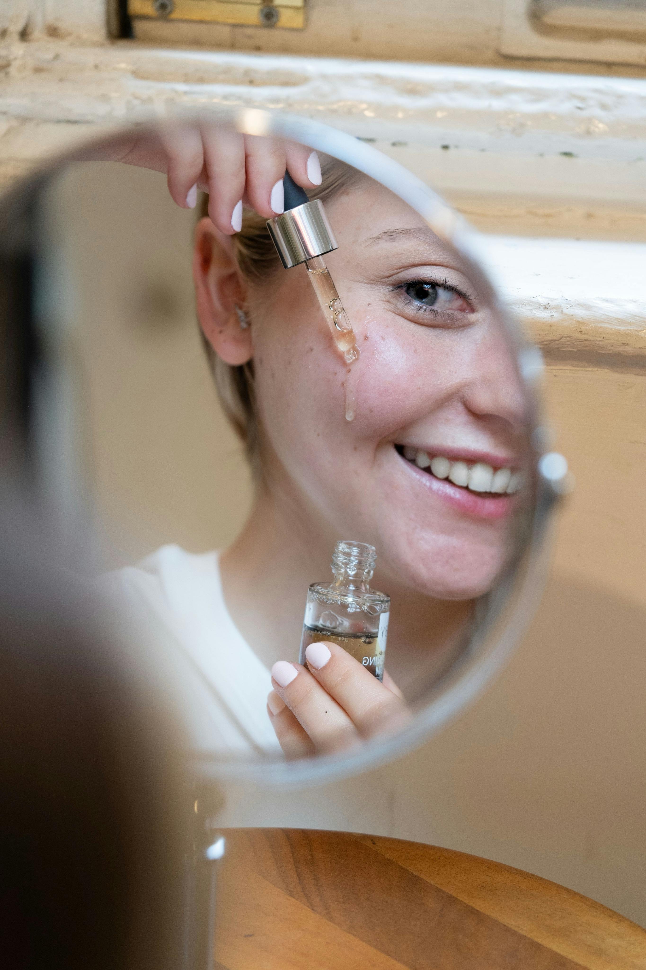 Applying centella serum — glowing skin