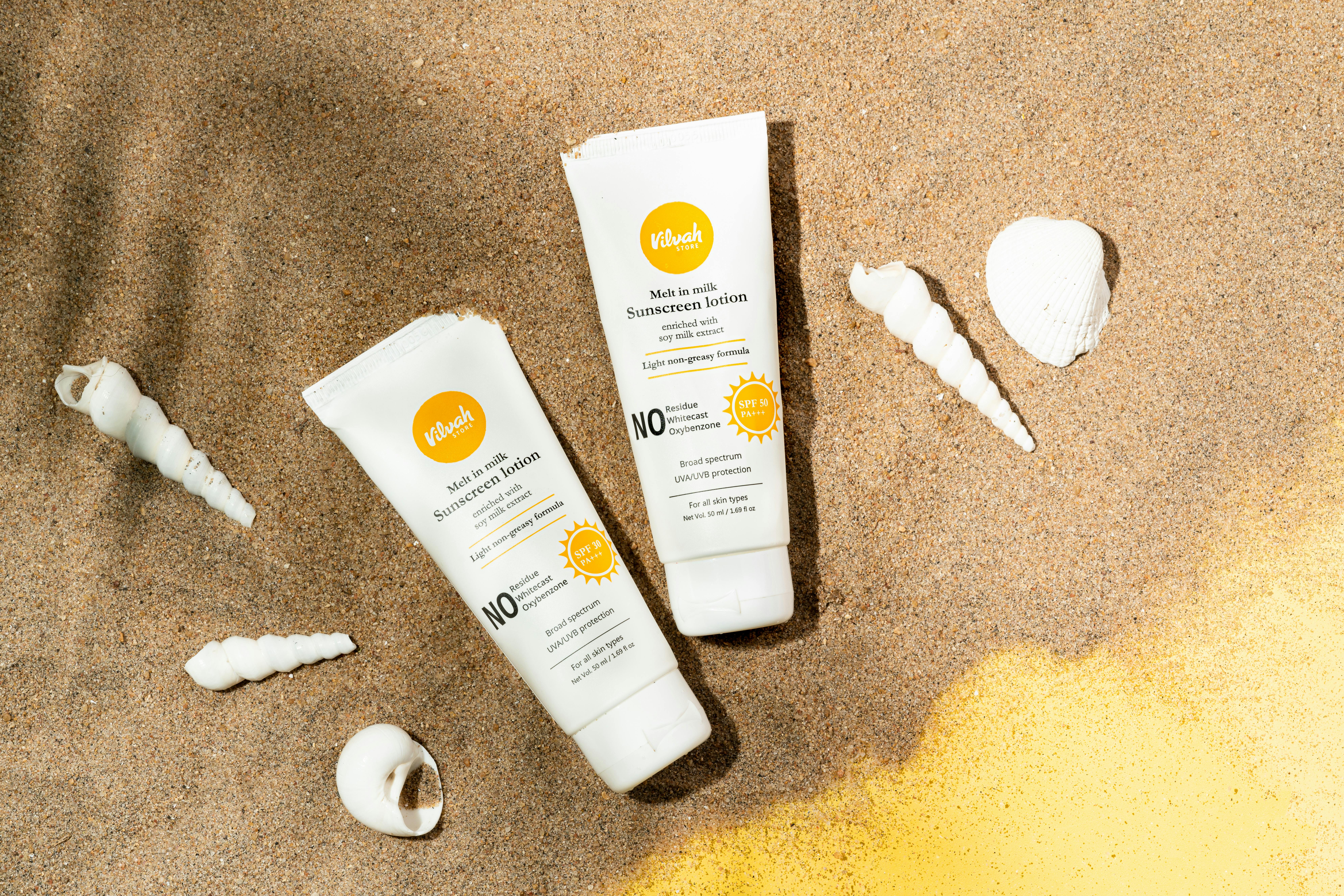 Sunscreen products in sand
